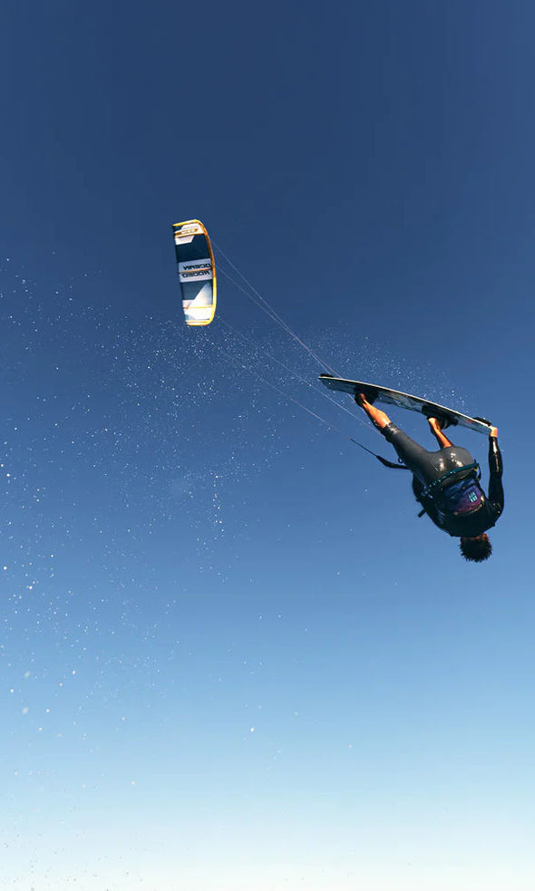ocean rodeo kite for kiteboarding, Big air, easy maneuver, light wind, Aluula, best kite out there. Man doing a jump with a board grab on the ocean rodeo rise.