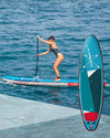 lady on Starboard stand up paddle board from Windstar watersports.. Inflatable paddle board for beginners to intermediate riders. 